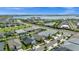 Picturesque residential community featuring a lake, lush green spaces, and neatly arranged homes at 16176 Lotus Way, Punta Gorda, FL 33982