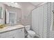 Cozy bathroom with a single sink vanity featuring granite countertops and a shower-tub combination at 16176 Lotus Way, Punta Gorda, FL 33982