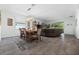 Bright dining room with stylish furnishings and décor, flowing into the living area at 16176 Lotus Way, Punta Gorda, FL 33982