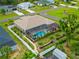 Aerial view of home with screened in pool, fenced in yard, and manicured landscaping in a quiet neighborhood at 1721 Walden Ct, Englewood, FL 34224