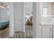 Hallway view shows the main bedroom, bathroom, and entryway to a guest room at 1721 Walden Ct, Englewood, FL 34224