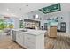 Open-concept kitchen with granite countertops flows into the living and dining areas at 1721 Walden Ct, Englewood, FL 34224