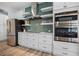 Close up of kitchen features stainless steel appliances and subway tile backsplash at 1721 Walden Ct, Englewood, FL 34224