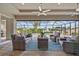 Relax on this covered patio with outdoor furniture and views of the beautiful pool at 1721 Walden Ct, Englewood, FL 34224