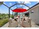 This relaxing patio offers comfortable seating and a beautiful view of the pool at 1721 Walden Ct, Englewood, FL 34224