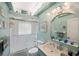 Bathroom featuring a shower/tub combination, vanity with sink, and a light blue color scheme at 17400 White Water Ct, Punta Gorda, FL 33982