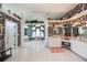 Large bathroom with dual sinks, floral wallpaper, and separate tub and shower at 17400 White Water Ct, Punta Gorda, FL 33982