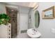 Updated bathroom with glass-enclosed shower and modern fixtures at 17400 White Water Ct, Punta Gorda, FL 33982