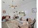 Bright room with a ceiling fan, a large window overlooking the yard, and a tiger at 17400 White Water Ct, Punta Gorda, FL 33982