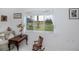 View of bright room with a large window looking out onto the landscaped yard at 17400 White Water Ct, Punta Gorda, FL 33982