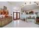Welcoming foyer with elegant tile flooring, decorative vases, and a view into the home's interior at 17400 White Water Ct, Punta Gorda, FL 33982