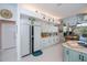 Bright kitchen boasts ample cabinet space, modern appliances, and stylish accents above cabinets at 17400 White Water Ct, Punta Gorda, FL 33982