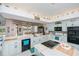 Well-designed kitchen with modern appliances, ample counter space, and a convenient breakfast bar at 17400 White Water Ct, Punta Gorda, FL 33982