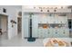 Functional kitchen with ample storage, modern refrigerator, and charming decorations above cabinets at 17400 White Water Ct, Punta Gorda, FL 33982