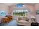 Bright living room boasts comfortable sofa, scenic views, and a cozy seating area at 17400 White Water Ct, Punta Gorda, FL 33982