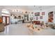 A large open living area boasting white tile floors, high ceilings, and natural light at 17400 White Water Ct, Punta Gorda, FL 33982