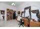 Bright room with arched windows with floral curtains, a ceiling fan, and lots of storage at 17400 White Water Ct, Punta Gorda, FL 33982