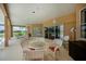 Expansive patio with multiple seating areas and a view of the luxurious backyard pool area at 17400 White Water Ct, Punta Gorda, FL 33982