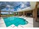 Beautiful pool featuring a connected spa and a screen enclosed lanai at 17400 White Water Ct, Punta Gorda, FL 33982