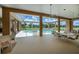 Beautiful lanai featuring a pool, spa, multiple seating areas, and a view of the luscious greenery at 17400 White Water Ct, Punta Gorda, FL 33982