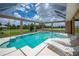 Lanai featuring a pool, hot tub, and multiple seating areas at 17400 White Water Ct, Punta Gorda, FL 33982