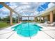 Spacious lanai featuring pool and spa. Sliding doors open to the house at 17400 White Water Ct, Punta Gorda, FL 33982