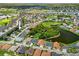 An aerial view of a community featuring ponds, a golf course, and well-maintained landscaping at 1812 Birmingham Blvd, Punta Gorda, FL 33980