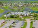 An aerial view of a community featuring tennis courts, a pool, and a community center at 1812 Birmingham Blvd, Punta Gorda, FL 33980