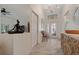 Open entryway featuring a chandelier, decorative door, and tiled flooring, creating an inviting space at 1812 Birmingham Blvd, Punta Gorda, FL 33980