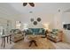 Inviting living room featuring tropical furnishings, a jute rug, and views into adjacent rooms at 1812 Birmingham Blvd, Punta Gorda, FL 33980