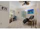Bright office with neutral tile floors, an accent chair, white desk and large window overlooking the lush landscaping at 1812 Birmingham Blvd, Punta Gorda, FL 33980