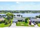 Aerial view of a waterfront home with lush green surroundings and easy water access at 18585 Klingler Cir, Port Charlotte, FL 33948