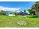 Spacious backyard with an enclosed pool area and room for entertaining at 18585 Klingler Cir, Port Charlotte, FL 33948