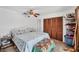Bedroom featuring a ceiling fan, closet, and dresser at 18585 Klingler Cir, Port Charlotte, FL 33948