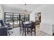 Dining room with sliding glass doors to the pool and outdoor seating area at 18585 Klingler Cir, Port Charlotte, FL 33948