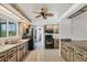Kitchen featuring light cabinets, stainless steel appliances, and tile flooring at 18585 Klingler Cir, Port Charlotte, FL 33948