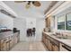 Kitchen featuring wood-look cabinets, stainless steel appliances, and tile flooring at 18585 Klingler Cir, Port Charlotte, FL 33948