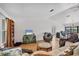 Comfortable living room with hardwood floors, cozy seating, and an adjacent dining and office area at 18585 Klingler Cir, Port Charlotte, FL 33948