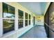 Inviting screened-in porch with bright decor, offering a relaxing outdoor space with views at 18585 Klingler Cir, Port Charlotte, FL 33948