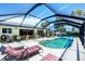 Beautiful screened pool area for year-round enjoyment and outdoor relaxation at 18585 Klingler Cir, Port Charlotte, FL 33948