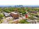 View of the house and surrounding area including nearby buildings and the downtown skyline at 2101 W Cherry St, Tampa, FL 33607