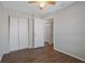 Bedroom with wood flooring, closet and a ceiling fan at 2101 W Cherry St, Tampa, FL 33607