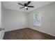 Bedroom features wood-look flooring and a ceiling fan at 2101 W Cherry St, Tampa, FL 33607