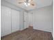 Bright bedroom featuring wood-look flooring, closet and a ceiling fan at 2101 W Cherry St, Tampa, FL 33607