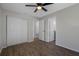 Bedroom features wood-look flooring, closet and ensuite bathroom at 2101 W Cherry St, Tampa, FL 33607