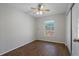 Bedroom with hardwood floors, ceiling fan, and large window at 2101 W Cherry St, Tampa, FL 33607