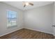 Bedroom with wood flooring, a large window and neutral paint at 2101 W Cherry St, Tampa, FL 33607