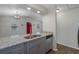 Kitchen with granite counters, stainless steel sink, dishwasher and view of the living area at 2101 W Cherry St, Tampa, FL 33607