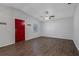 Bright living room with hardwood floors and red front door at 2101 W Cherry St, Tampa, FL 33607