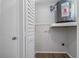 Utility room features washer and dryer hookups and storage space at 2101 W Cherry St, Tampa, FL 33607